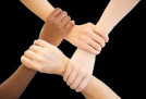 Four hands holding wrist